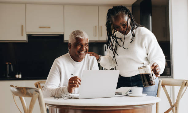 istock Supportive woman bringing her working husband some hot coffee 1437853422
