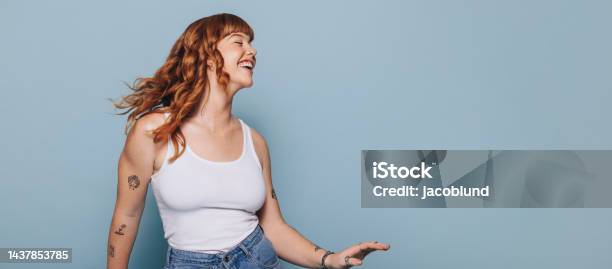 Woman With Ginger Hair Dancing And Having Fun In A Studio Stock Photo - Download Image Now