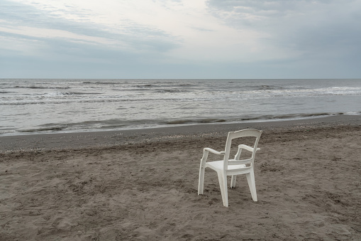 Lonely chair on sea beach