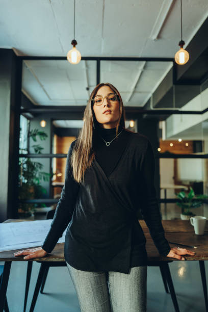 istock Female business professional standing in a boardroom 1437854946
