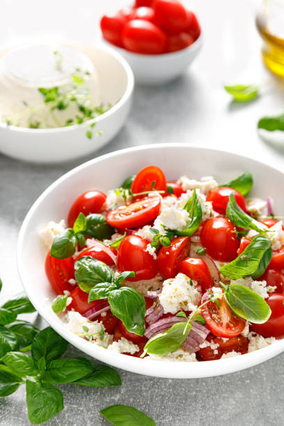 istock Salad with tomato, italian ricotta cheese and basil 1437855230