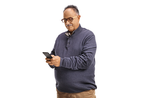 Casual mature man using a smartphone isolated on white background