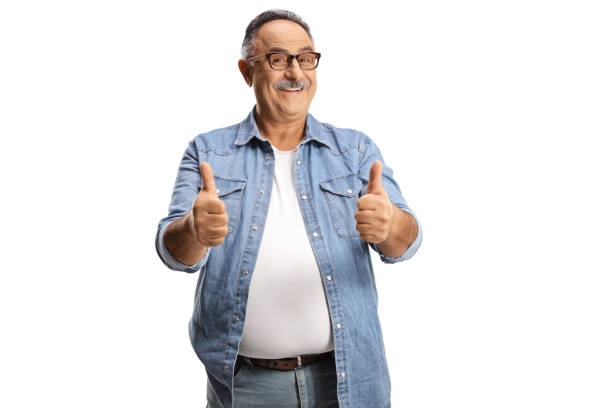 Casual mature smiling man showing both thumbs up stock photo