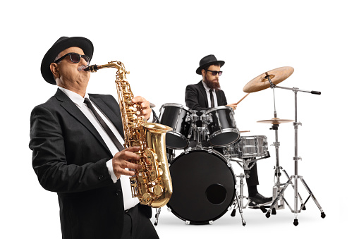 Man playing a saxophone and a drummer performing isolated on white background