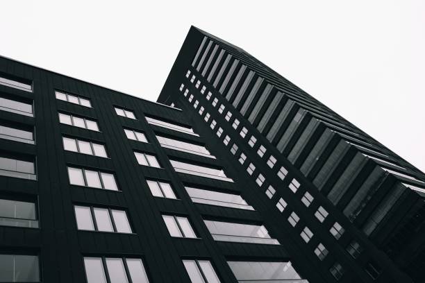 istock Low angle view of modern building against clear sky 1437856560