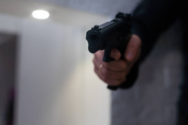istock A man's hand with a toy gun 1437856573