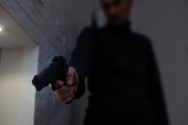 istock A man's hand with a toy gun 1437856640