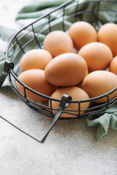 istock Basket of fresh brown eggs 1437856699