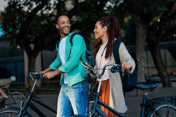 istock Couple waking with bikes outside. 1437858279