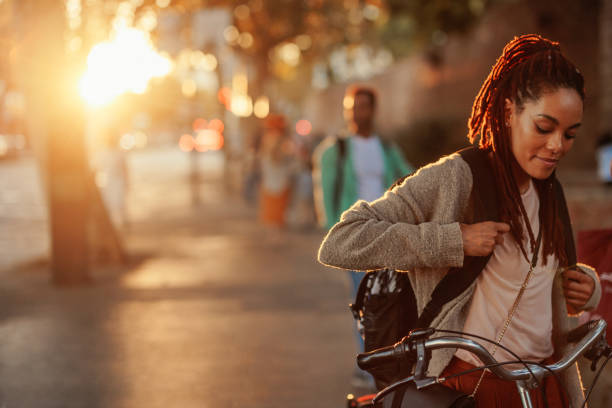 istock Cheerful woman with bicycle and copy space. 1437858292