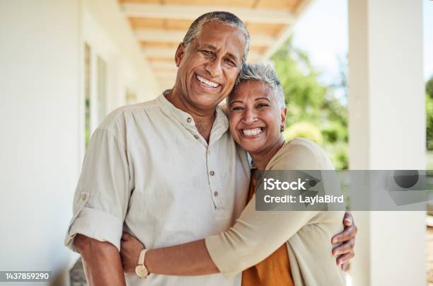 Retirement Couple Portrait And Hug Outdoor Of House Dream Home And Garden In Love Care And Bond Of Quality Time Together In Colombia Happy Man Smile Woman And Senior People Relax In Backyard Sun Stock Photo - Download Image Now