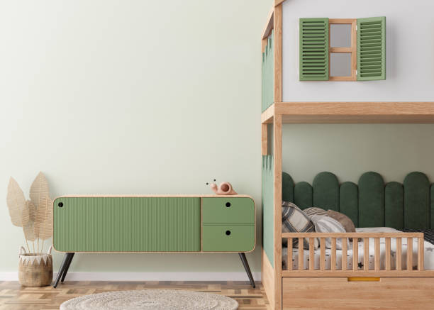 istock Empty light green wall in modern child room. Mock up interior in scandinavian style. Copy space for your picture or poster. Bed, sideboard, rattan basket. Cozy room for kids. 3D rendering. 1437860912