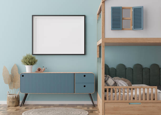 istock Empty horizontal picture frame on blue wall in modern child room. Mock up interior in contemporary, scandinavian style. Free, copy space for picture. Bed, toys. Cozy room for kids. 3D rendering. 1437860920