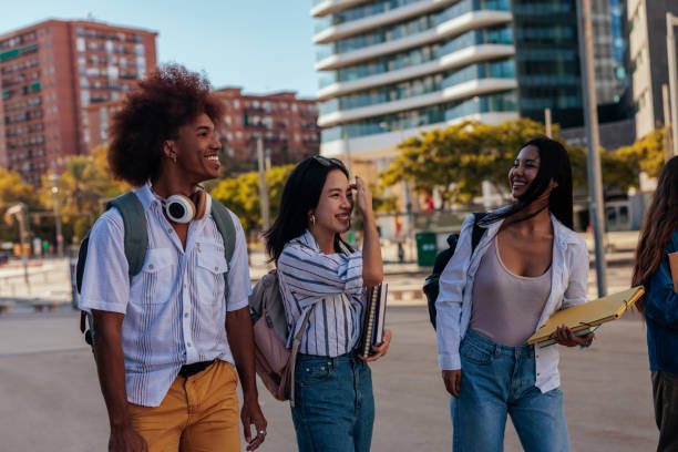 istock University students walking in the city. 1437861167