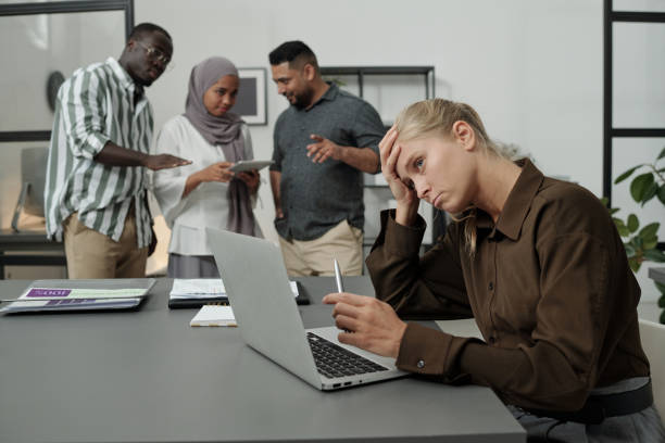 istock Young tired businesswoman trying to concentrate during work over project 1437862262