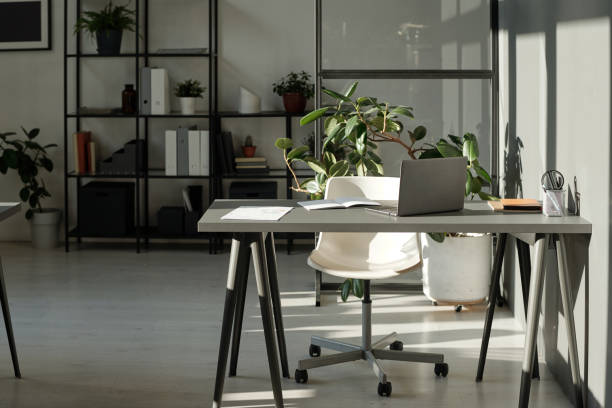 istock Workplace of modern manager or employee by wall in openspace office 1437862347