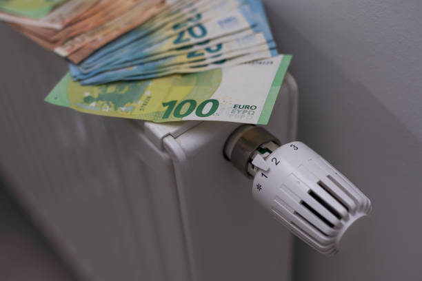 istock Money on heating battery. euros 1437865408