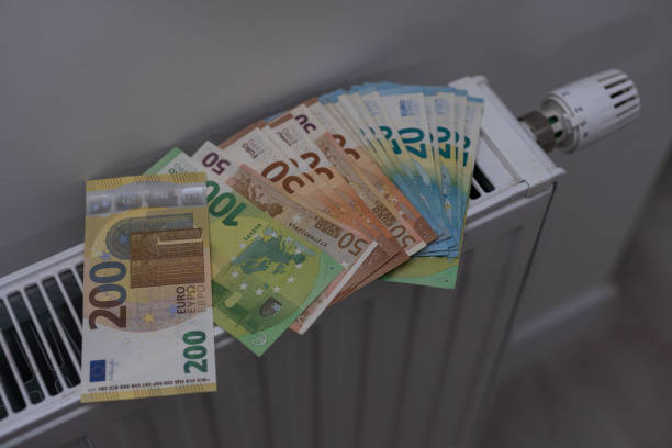 istock Money on heating battery. euros 1437865723