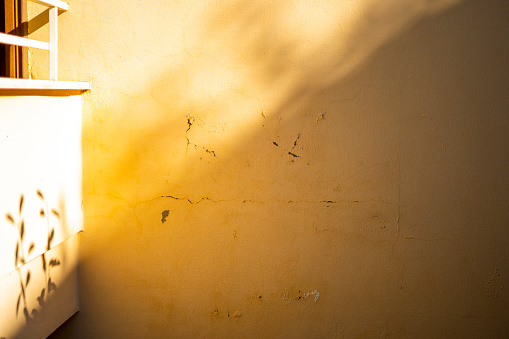 Yellow wall and shadow on wall