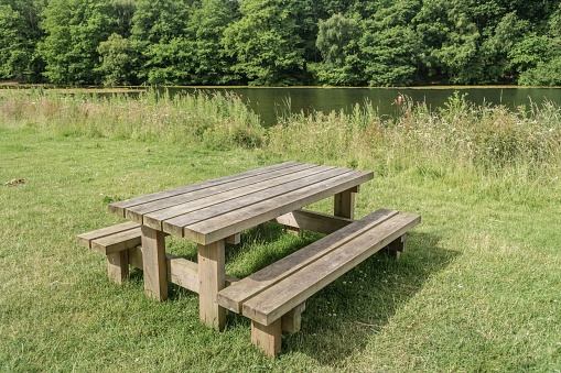 Staffordshire Lakeside bench sunny day landscape, Stoke-on-Trent UK.