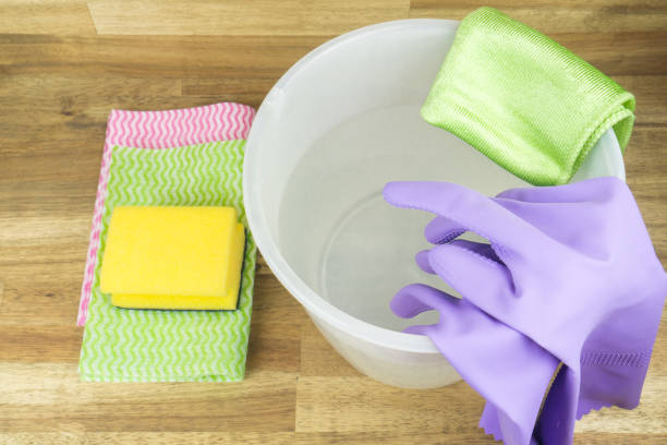 istock Spring cleaning, rubber gloves, bucket, sponge and cleaning rag 1437872402