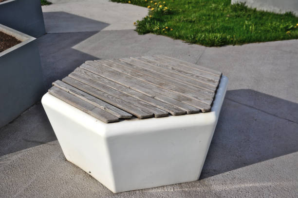 istock plastic hexagonal bench with wooden planks isolated, close-up 1437873362