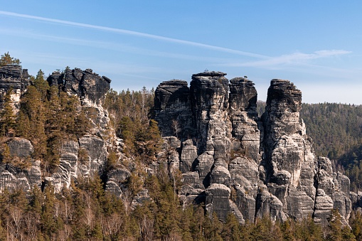 A scenic view of Saxon Switzerland sandstone cliffs in a rural area in Saxony, Germany, in daylight