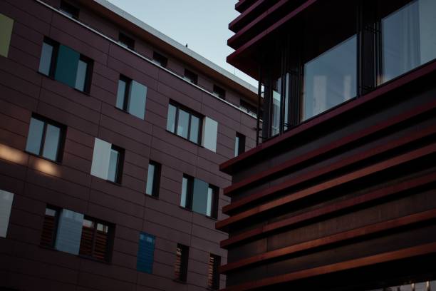 Magnificent shot of two lofty modern building facades neighboring one another