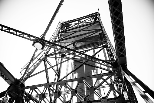 A low-angle grayscale shot of the dramatically iconic Stillwater lift bridge in Minnesota