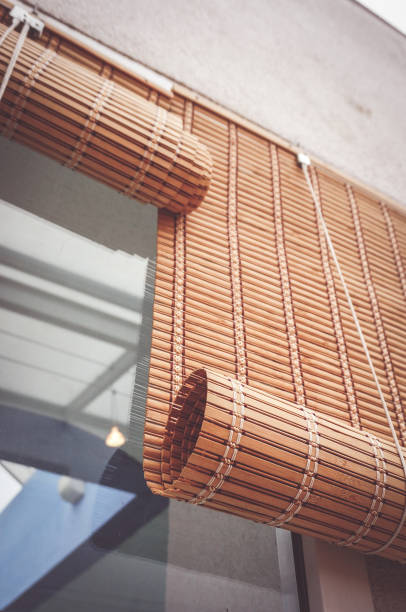 istock Low angle of the wooden rolled blinds on the window 1437874882