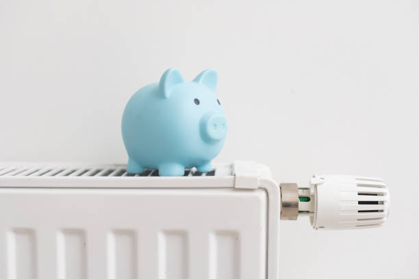 istock Heating battery with piggy bank on it 1437875400