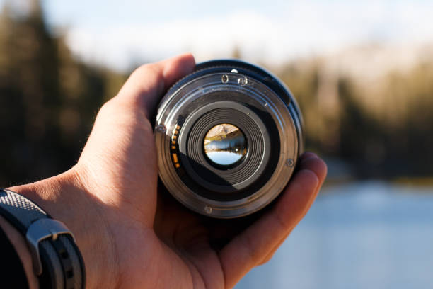 istock Selective focus shot of a person holding a camera lens 1437875484