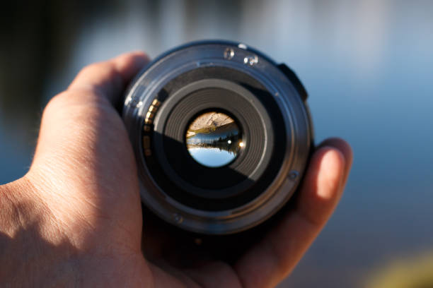 istock Selective focus shot of a person holding a camera lens 1437875485