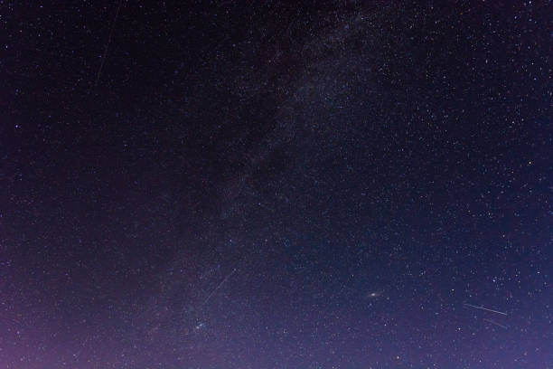 istock Low angle shot of a stary horizon at night 1437875649
