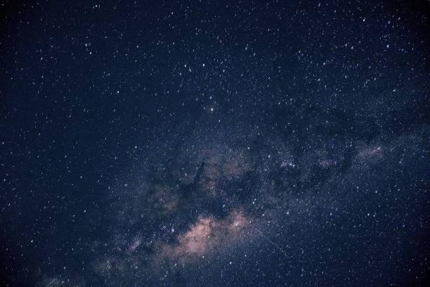 istock Milky Way galaxy on the starry night sky - the beautiful universe background 1437876397