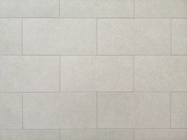 istock Closeup shot of a stone wall with tiles and patterns - copy space 1437876839