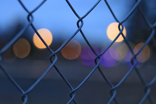 A closeup shot of a fence on a blurry background