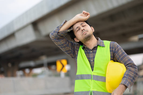 Construction workers are tired from work. stock photo