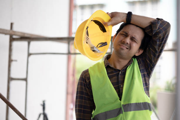 istock Asian male construction worker tired from hard work 1437877561