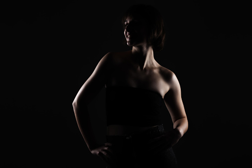 dark side lit beauty portrait of a lady with short hair