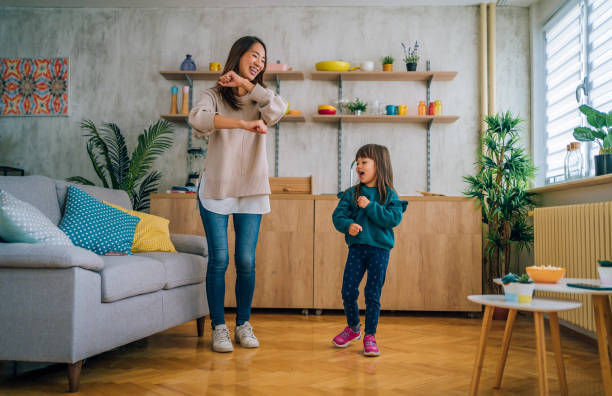 istock Mother and little daughter having fun at home 1437880196