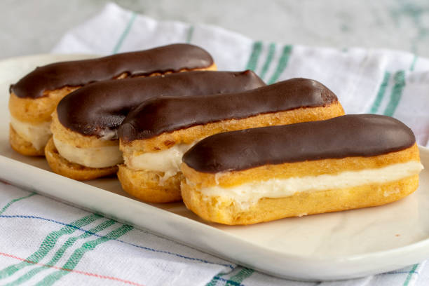 istock Chocolate eclair cake on gray background. Bakery products. close up 1437881907