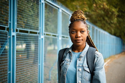 Portrait of a beautiful, young African American woman enjoying a walk outdoors