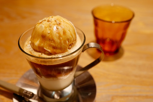 An Italian dessert called affogato al caffe. Vanilla ice cream and espresso.