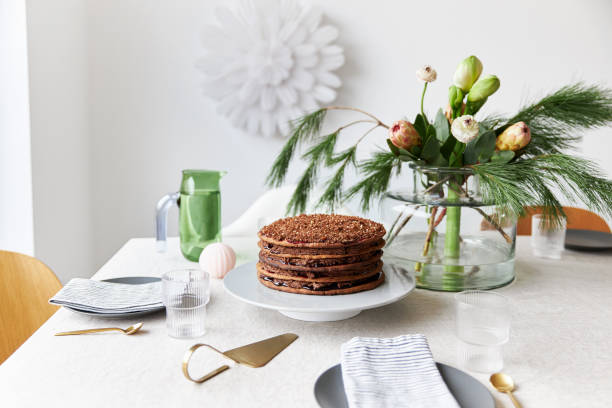 istock A gingerbread cake stands on a table decorated in a modern, Christmassy way 1437883509