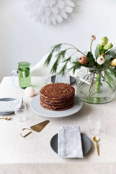 istock A gingerbread cake stands on a table decorated in a modern, Christmassy way 1437883571
