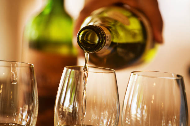 istock Pouring wine into a wine glass 1437883800