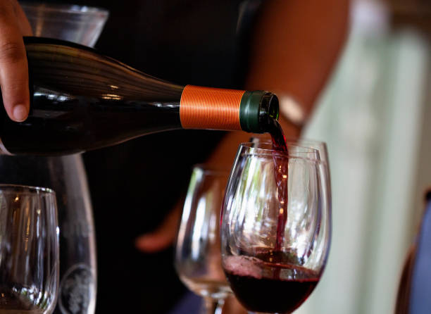 istock Pouring wine into a wine glass 1437883964