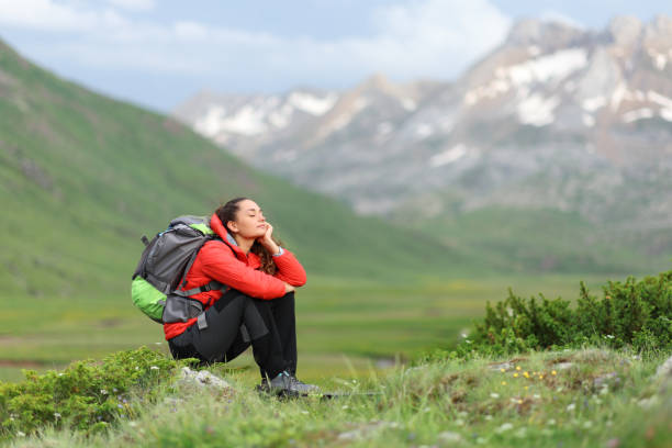 istock Hiker in red resting enjoying in the mountain 1437884670