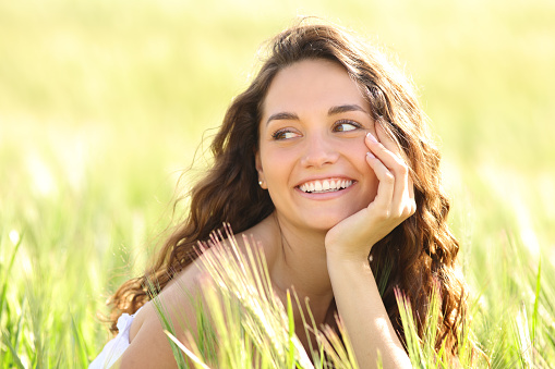 Beautiful woman smiling in a wheat field